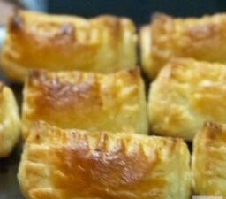 A close up of some pastries on a pan